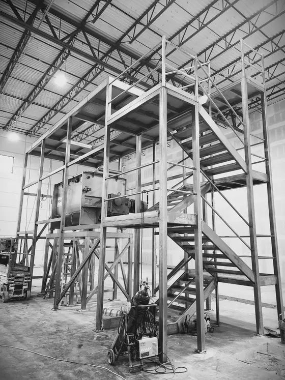 Elevated structural steel equipment platform and stair tower fabricated by Wetzel Welding